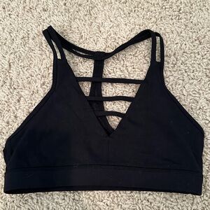 Zyia Black Sports Bra Size Small. V cut in Front and Mesh on the Back.